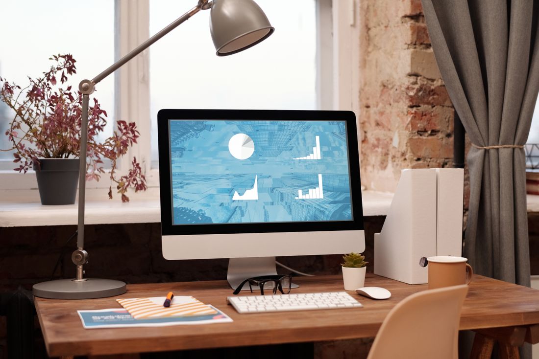 A desk workspace in a room, representing how KK ECOMMERCE started in 2017